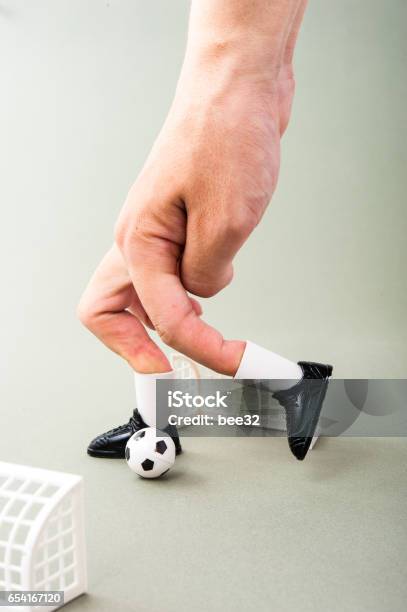 Miniature Football Game With Human Fingers Stock Photo - Download Image Now - Human Body Part, Human Finger, Human Foot