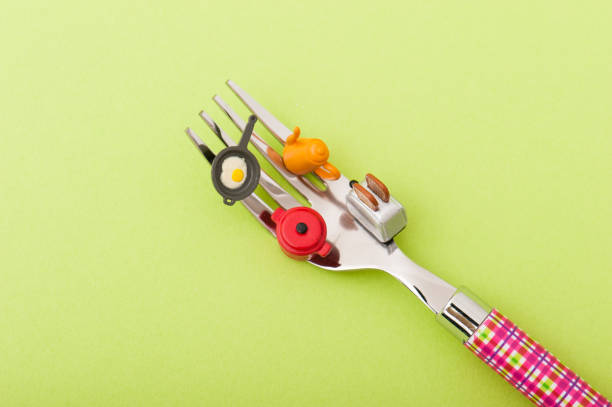 istock Miniature got on top of fork kitchenware and food 654167404