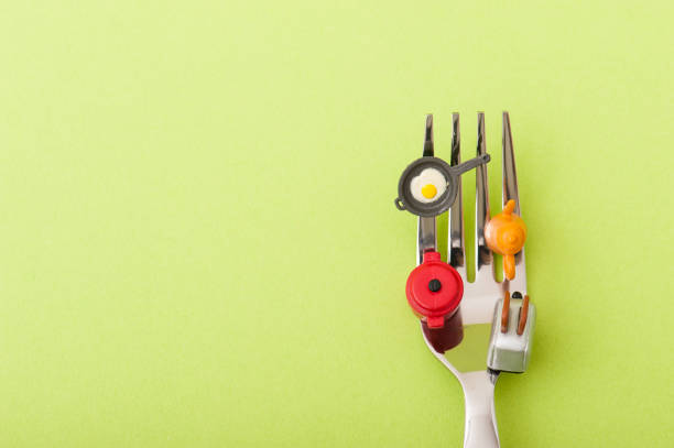 istock Miniature got on top of fork kitchenware and food 654167420