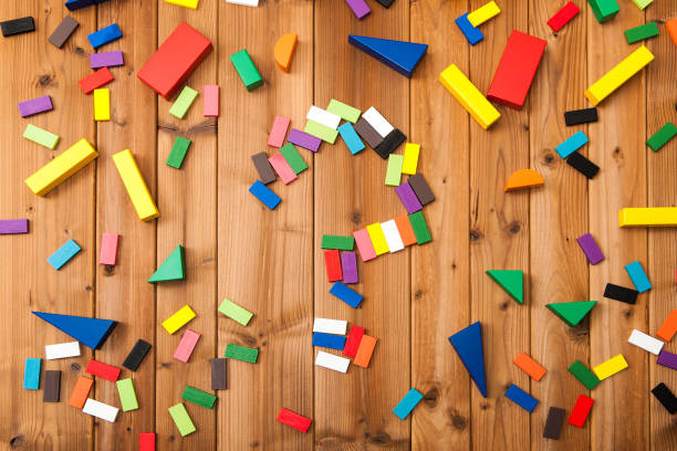 istock Building blocks on wooden background 654171500