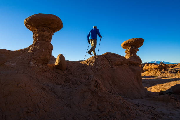 Hiking Amongst Hoodoos with Henry Mountains - Utah canyon country.