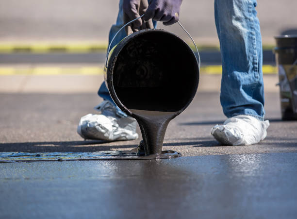 istock Close-Up of Do it Yourself Driveway Seal Coating 654180902