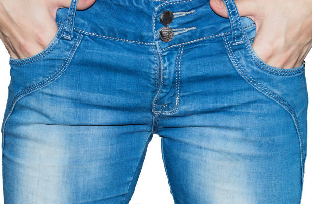 istock A woman in blue jeans isolated on white background. 654185726