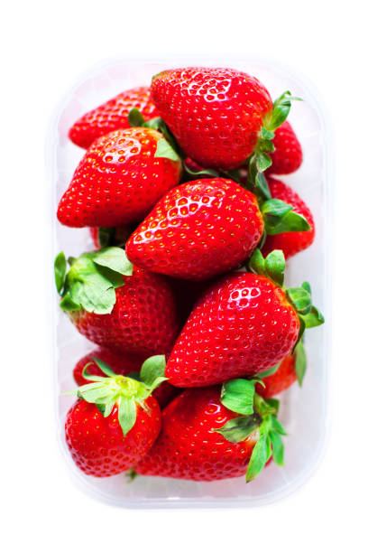 istock Fresh Strawberries in a box isolated on white  background close up 654186790