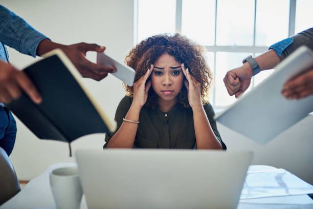 Can I get a moment to breathe? Shot of a stressed out young woman working in a demanding career squander stock pictures, royalty-free photos & images