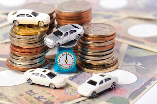 istock Miniature cars and coins 654190646