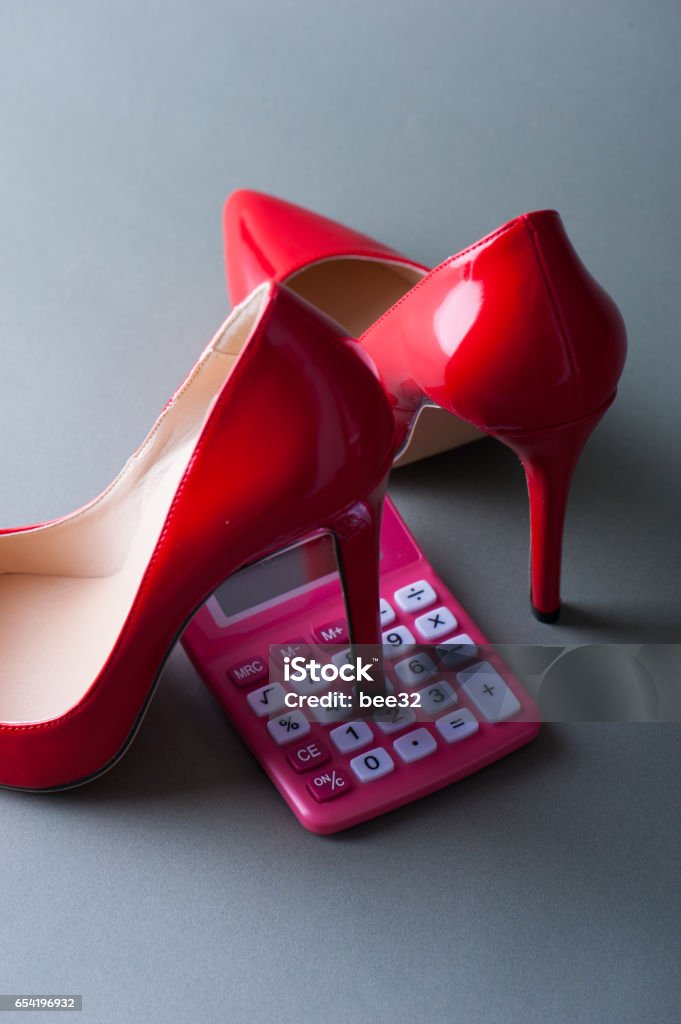 Calculator of the pink and Red high heels Calculator Stock Photo