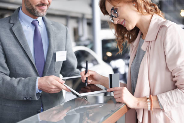 Salesman using digital tablet to sign in