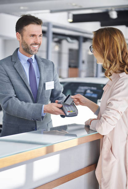 istock Female customer paying for new purchase 654200278