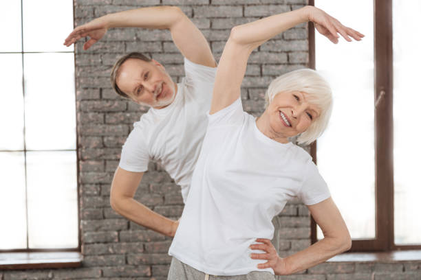 istock Attractive old woman doing morning exercises 654200732