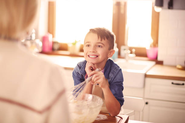 istock Cute boy listening very carefully 654203740