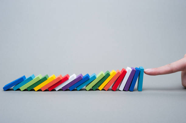 Colorful dominoes and human hands