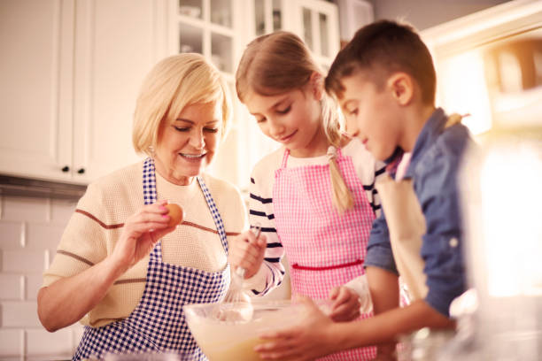 istock Baking a cake with grandmother 654204024