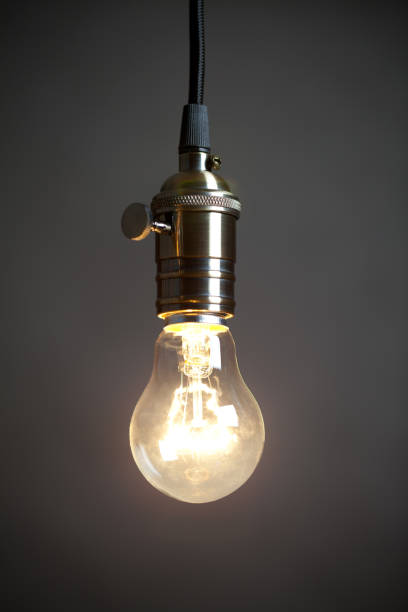 istock Vintage incandescent light bulb on grey background 654206978