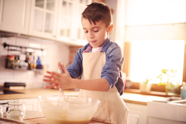 istock Little masterchef combine all the ingredients 654210080