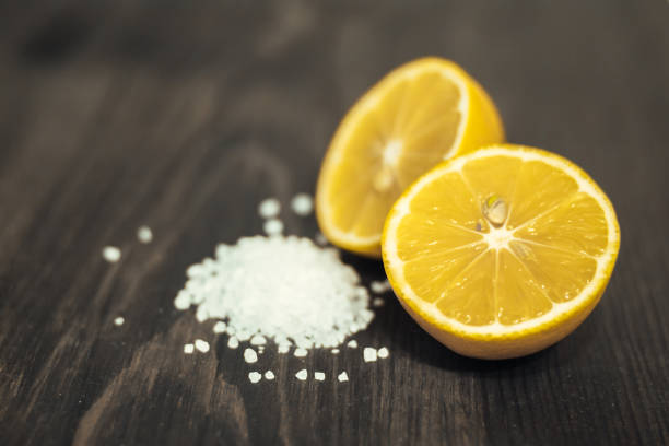 istock Fresh sliced lime, lemon and salt on wood table 654210494