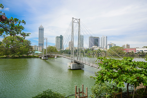 Waterfront and bridge at Gangaramaya Park, Colombo, Sri Lanka.