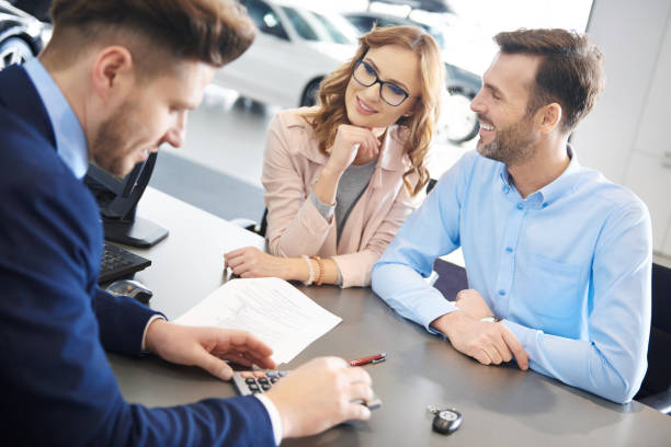 istock Salesman figuring the car expense 654216268