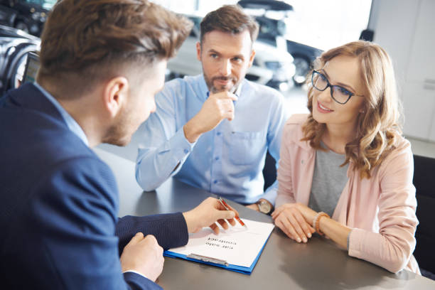 istock Man showing where to put the signature 654217724