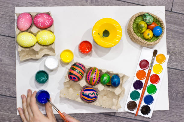 istock Woman painting Easter eggs. Happy easter. 654223676