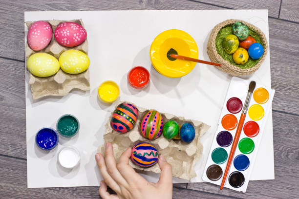 istock Woman painting Easter eggs. Happy easter. 654223690