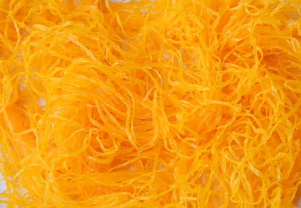 istock close up of golden egg threads on white dish 654228032