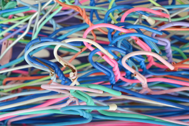 istock colorful clothes hanger heap in basket 654228868