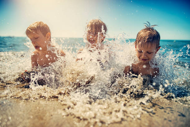 istock Kids splashing in the mediterranean sea 654231886