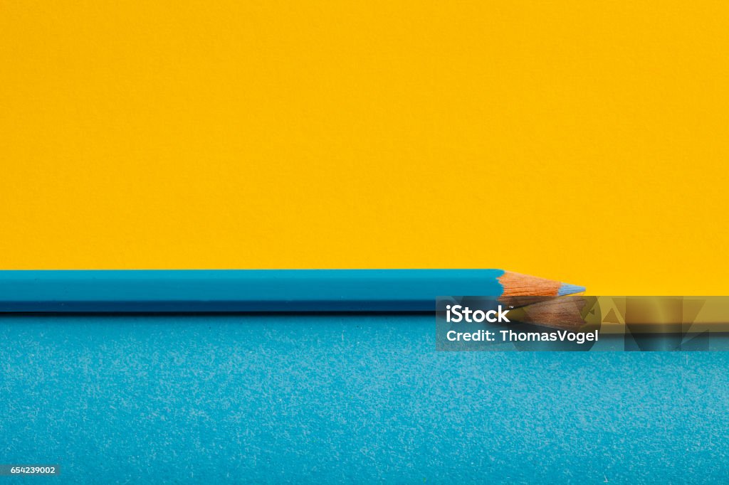 Yellow Blue Pencil Background Photography of a yellow and blue pencil. Two Objects Stock Photo