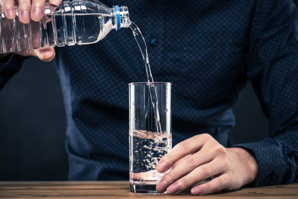 istock Men with plastic bottles filled with water 654239672