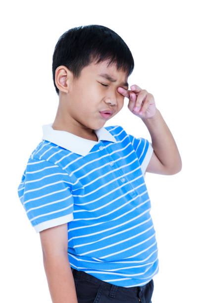 istock Eyes Pain. Asian child suffering from eyestrain. 654244072