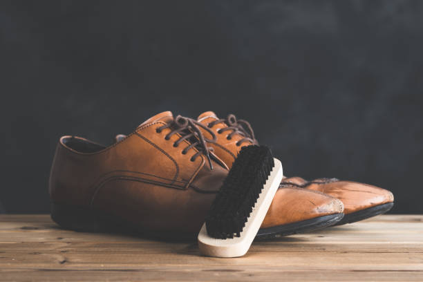 istock Shoes and shoe brush 654244152