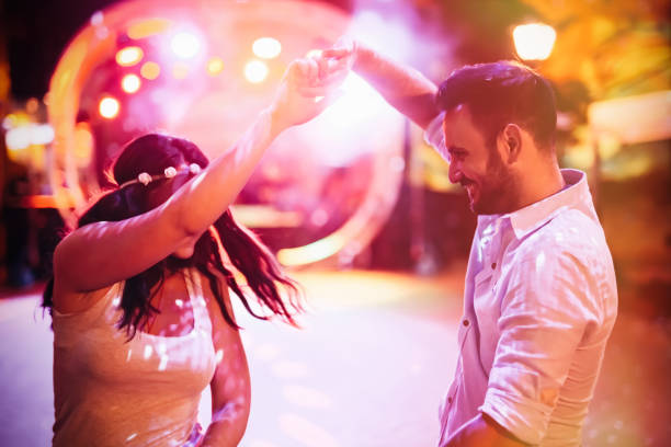 istock Happy couple dancing in club 654247686