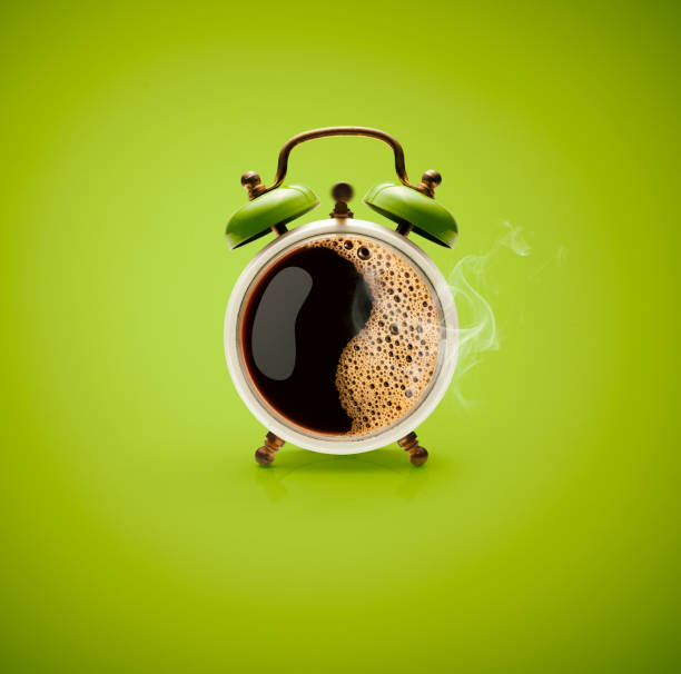 Hot Coffee Retro Alarm Clock Photography of hot coffee in a retro alarm clock. reminder photos stock pictures, royalty-free photos & images