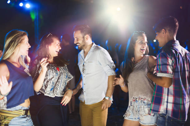 istock Group of friends clubbing and having fun while dancing 654252446