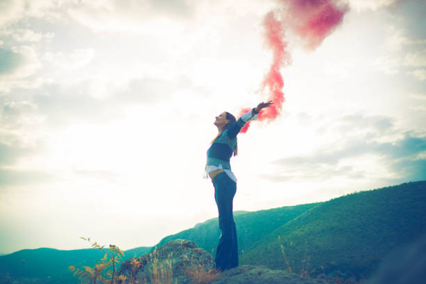 istock Woman with torch on mountain 654258556