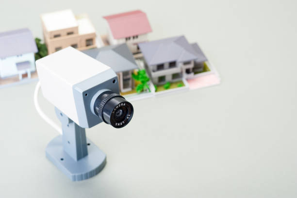 istock Miniature House and security cameras 654259192