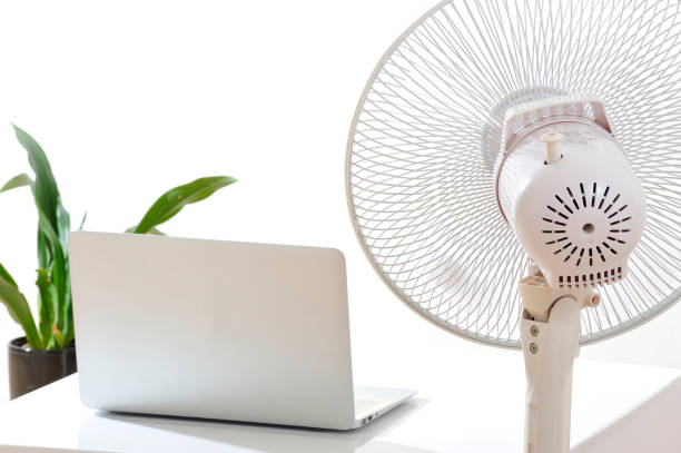 istock Laptop and a fan 654259526