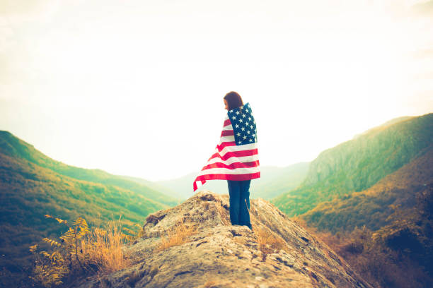 istock Woman wrapped in US flag 654262222