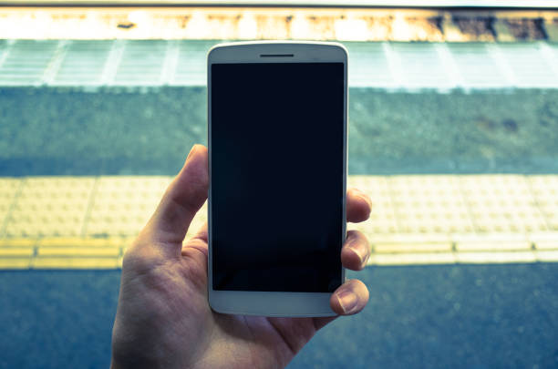 istock Man with a smart phone at the station's hand 654269400