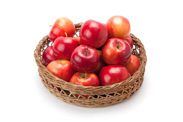 istock apples arranged in a basket isolated on white background 654271134