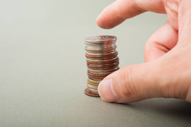 istock Japan-Yen coins and human hands 654276084