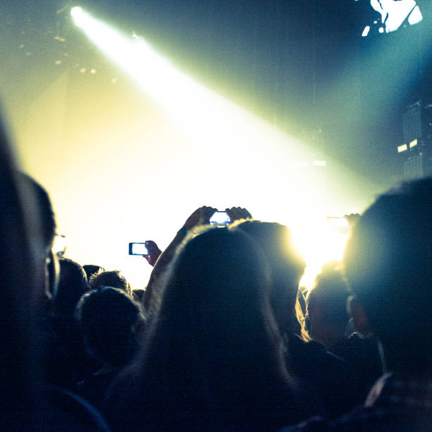 istock Taking picture with mobile phone at music concert 654277308