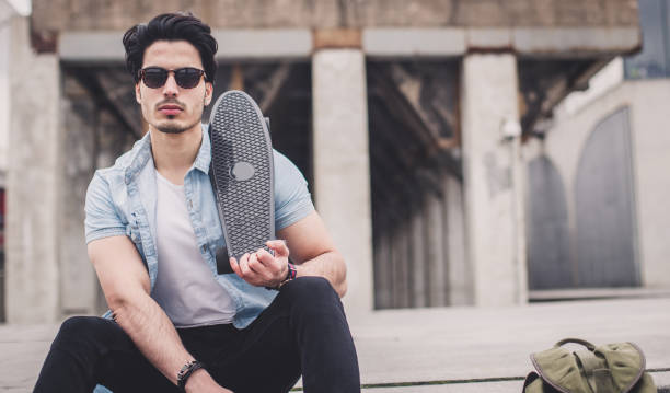istock Skater relaxing outdoors 654284238