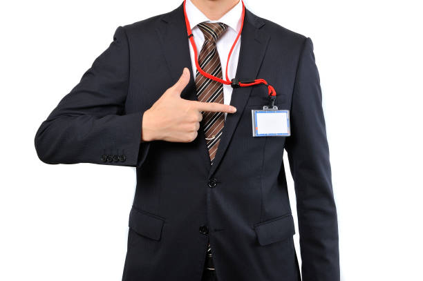 istock Businessmen from the neck down gesture ID holder 654284734