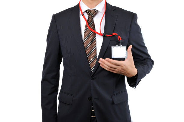 istock Businessmen from the neck down gesture ID holder 654284748