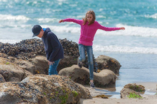 istock Kids exploring the tide pools at Cape Kiwanda on Oregon coast 654285192