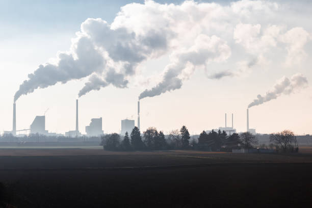 Smoking Chimneys of a Coal Fired Power Plant stock photo