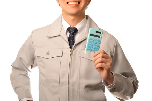 Young Japanese man wearing work clothes have a blue calculator