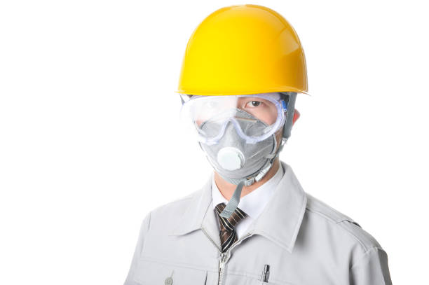 istock Young Japanese man wearing work clothes wearing face masks and helmets 654294752